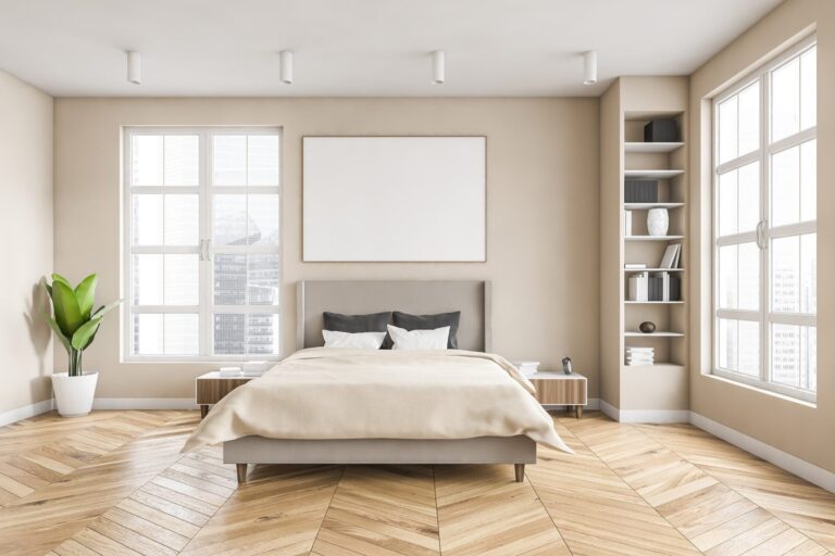 Hardwood flooring in bedroom with light walls